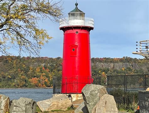 red house lighthouse with metal bridge roadway|little red lighthouse.